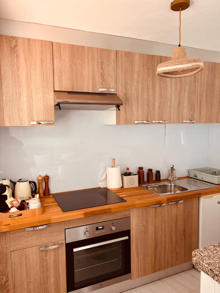 Second kitchen with wooden worktop and oven